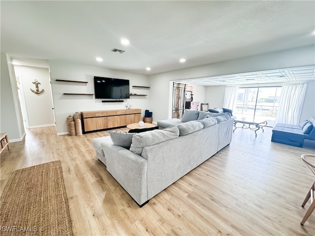 living room with light hardwood / wood-style floors