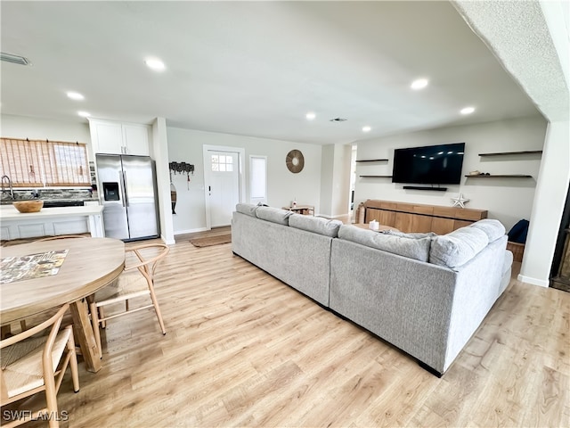 living room with light hardwood / wood-style floors