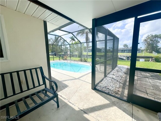 view of pool with a water view