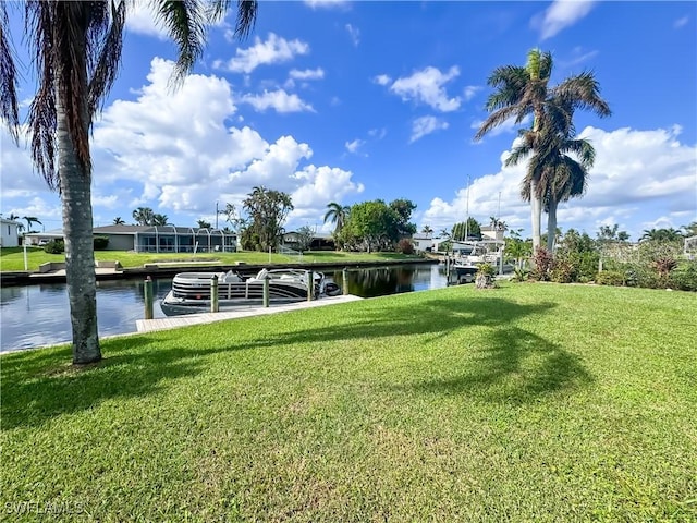 view of dock featuring a water view and a lawn