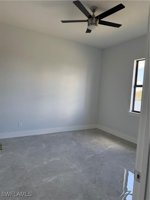 spare room with ceiling fan