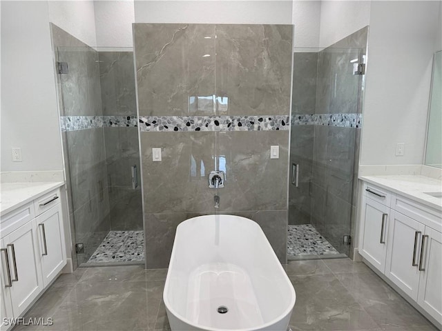 bathroom featuring vanity and separate shower and tub