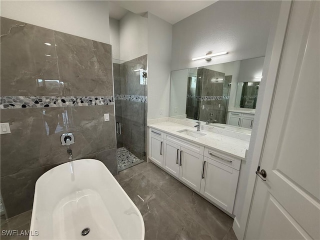 bathroom featuring vanity and separate shower and tub