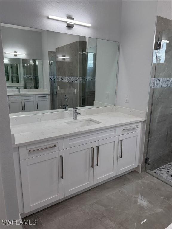 bathroom with vanity and an enclosed shower