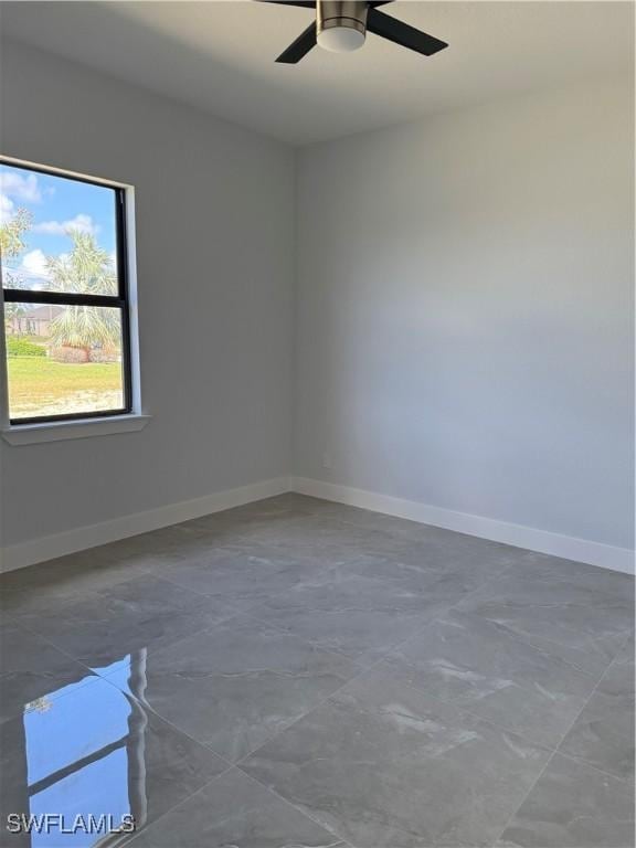 spare room with ceiling fan