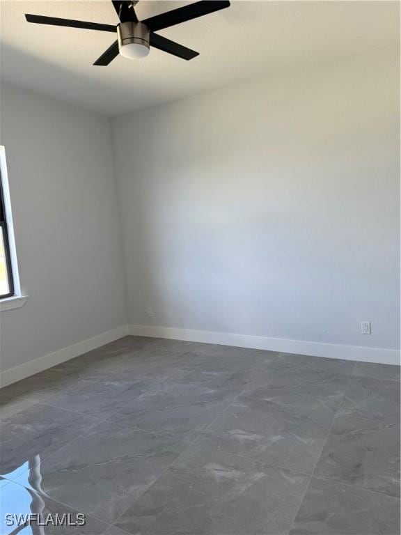 spare room featuring ceiling fan