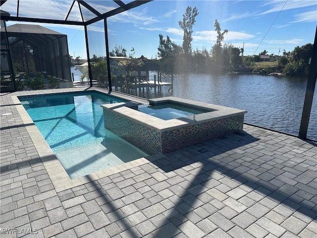 view of swimming pool featuring glass enclosure, an in ground hot tub, a water view, and a patio