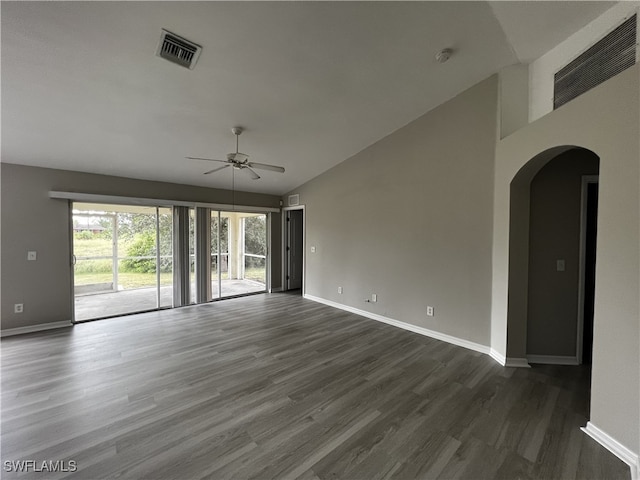 unfurnished room with dark hardwood / wood-style flooring, ceiling fan, and vaulted ceiling