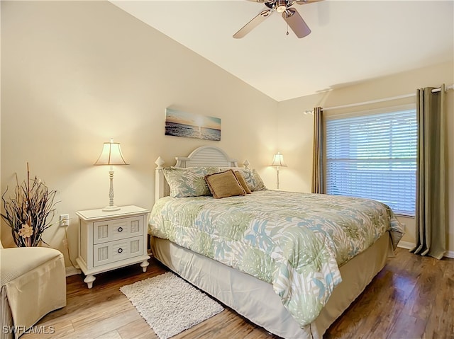 bedroom featuring light wood-type flooring, ceiling fan, and lofted ceiling