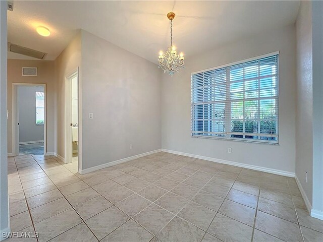 20752 Mystic Way N, Fort Myers, FL 33917 - unfurnished room with a chandelier and light tile patterned flooring