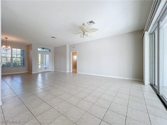 20752 Mystic Way N, Fort Myers, FL 33917 - spare room featuring light tile patterned flooring, a chandelier, and a ceiling fan