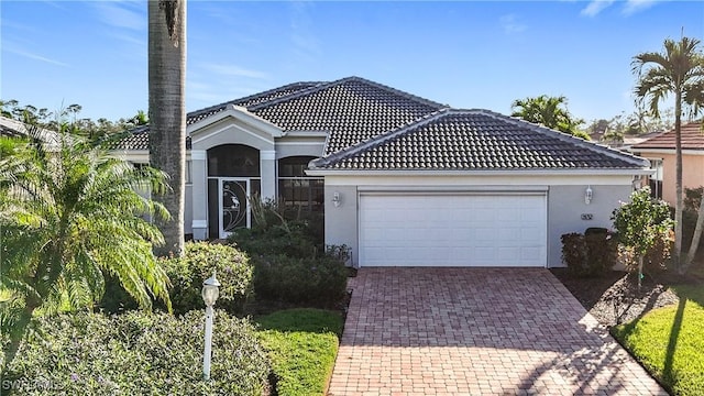 view of front of home with a garage