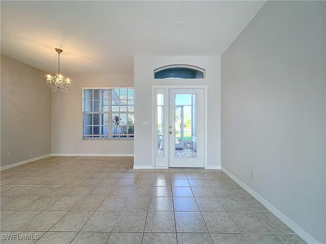 20752 Mystic Way N, Fort Myers, FL 33917 - foyer entrance featuring a chandelier and light tile patterned flooring