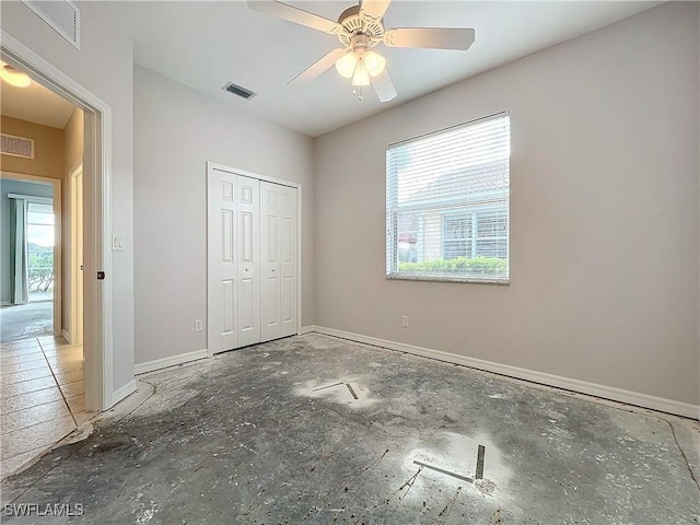 unfurnished bedroom featuring a closet and ceiling fan