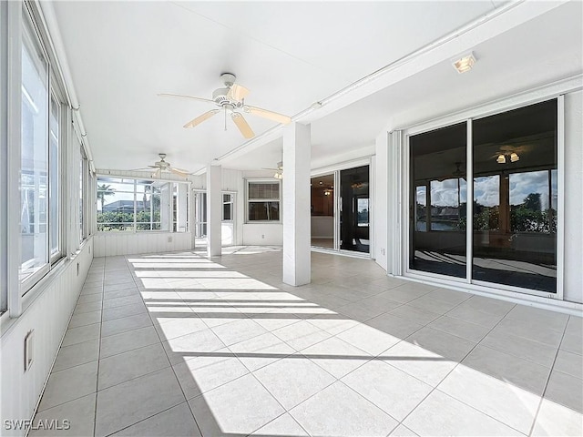 20752 Mystic Way N, Fort Myers, FL 33917 - unfurnished sunroom featuring ceiling fan