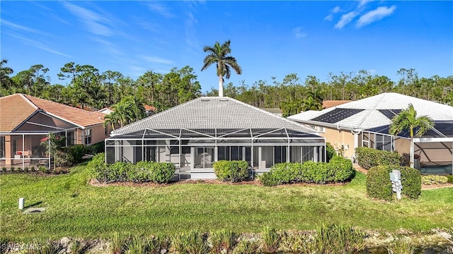 back of property featuring glass enclosure