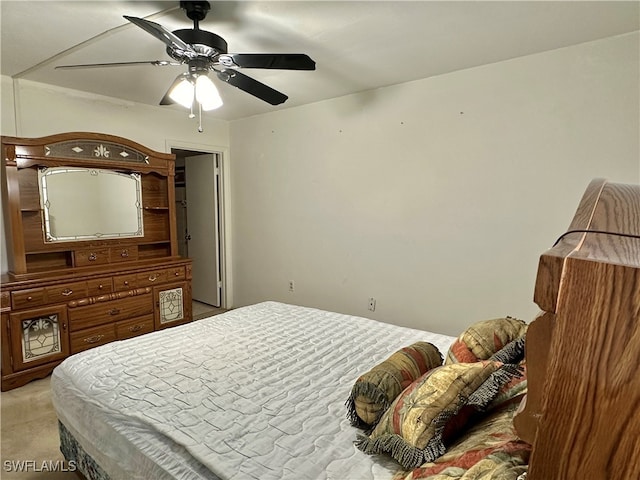 bedroom with light carpet and ceiling fan