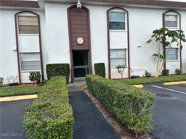 2828 Jackson St Unit F-7, Fort Myers, FL 33901 - view of building exterior featuring uncovered parking
