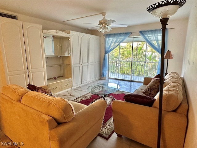 living room featuring ceiling fan