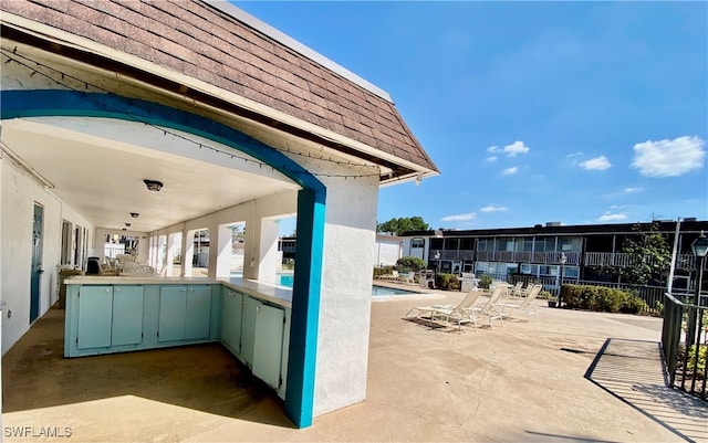 view of patio featuring a community pool