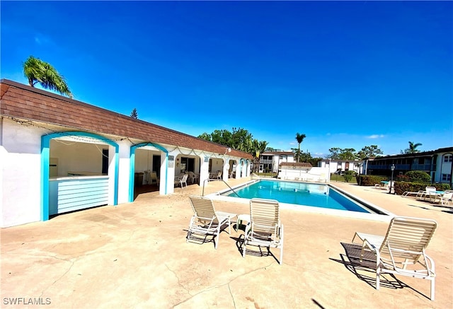 view of swimming pool featuring a patio area