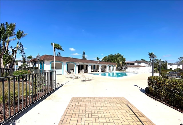 view of swimming pool featuring a patio area