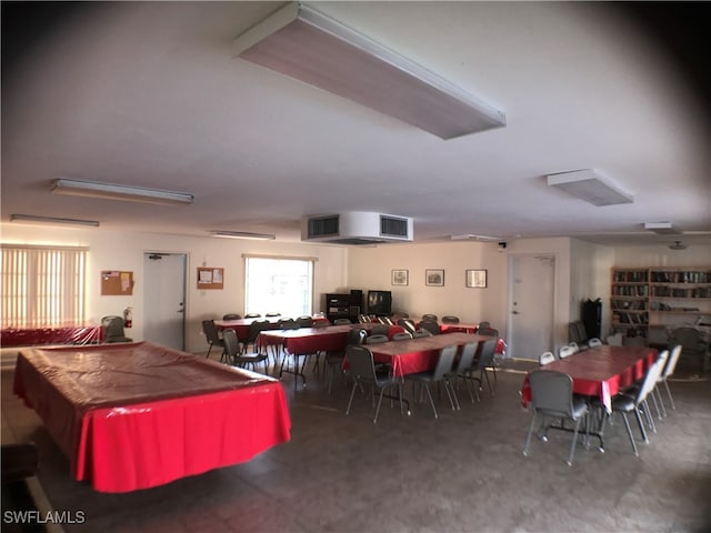 dining room featuring dark carpet and pool table