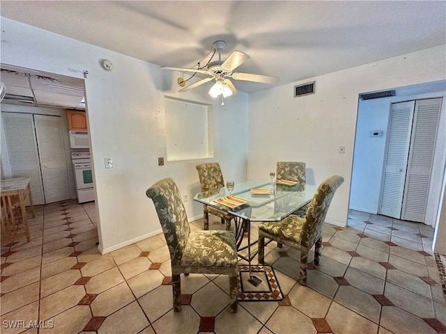 dining area with ceiling fan and light tile patterned flooring