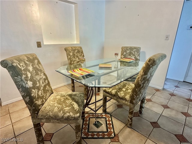 dining space with light tile patterned floors