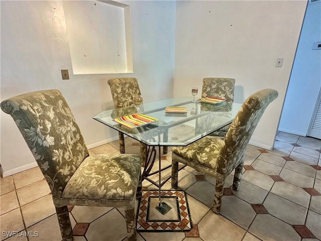2828 Jackson St Unit F-7, Fort Myers, FL 33901 - tiled dining area with baseboards