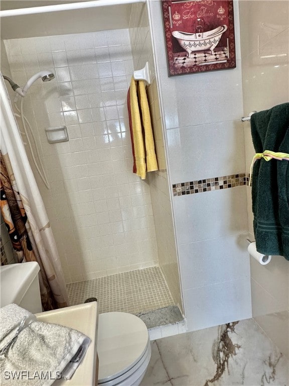 2828 Jackson St Unit F-7, Fort Myers, FL 33901 - bathroom with toilet, tiled shower, and marble finish flooring