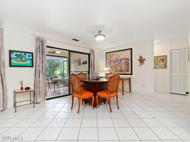 dining area with light tile patterned flooring