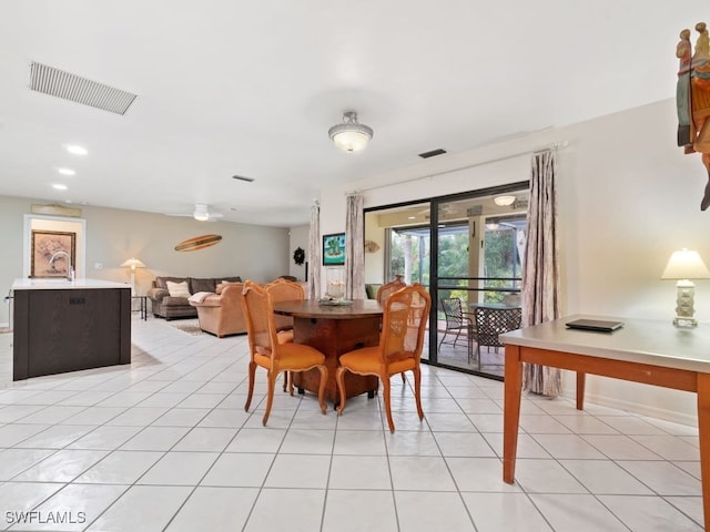 dining space with light tile patterned flooring