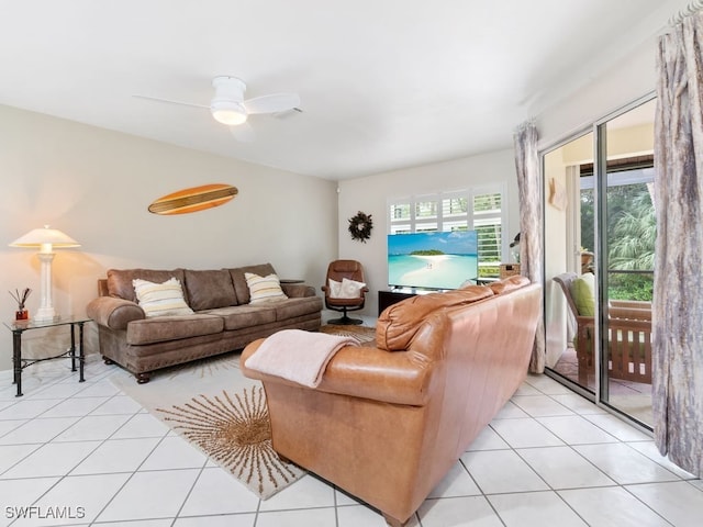 living room featuring ceiling fan and light tile patterned flooring