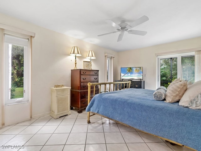 bedroom with light tile patterned flooring, multiple windows, and ceiling fan