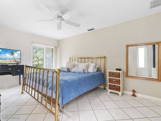 bedroom with ceiling fan and light tile patterned floors