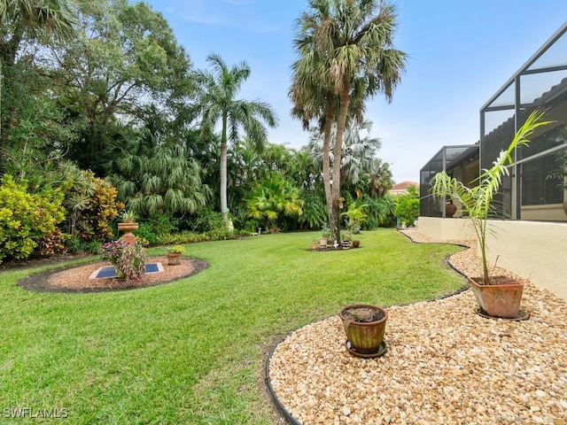 view of yard with a lanai