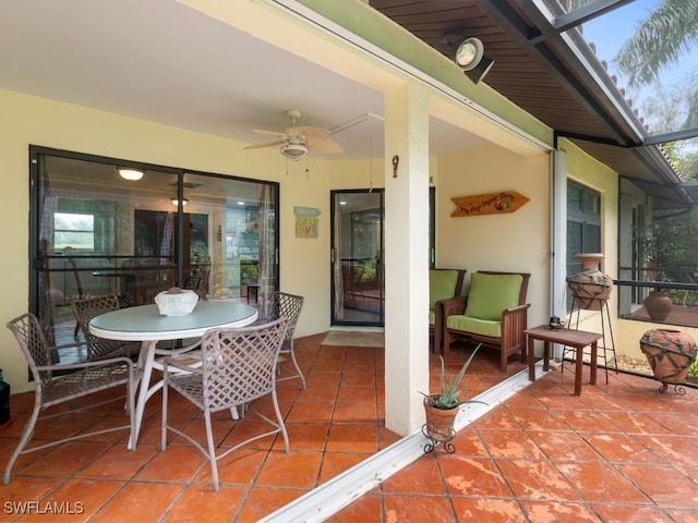 view of patio with a lanai and ceiling fan