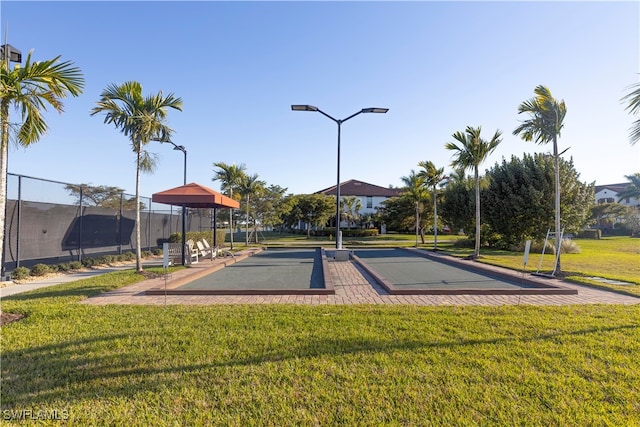 view of property's community featuring a yard