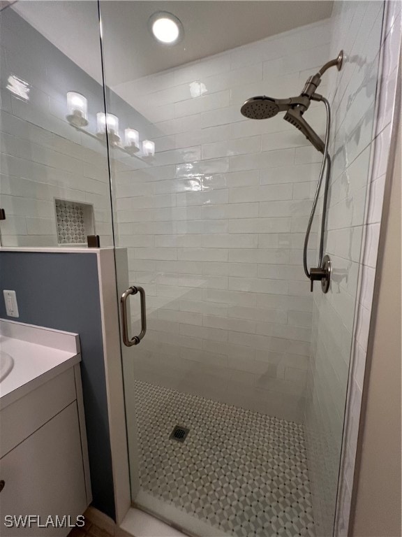 bathroom with vanity and an enclosed shower