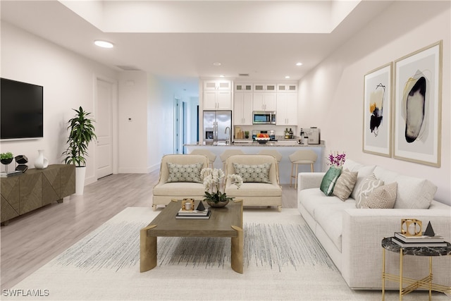 living room with light hardwood / wood-style flooring