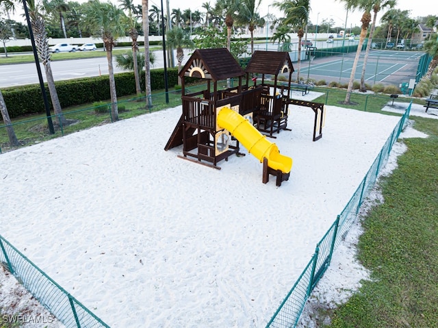 view of playground with tennis court