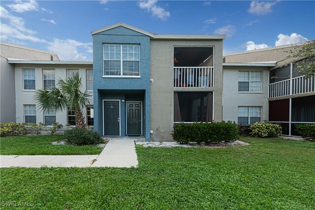 view of property with a front lawn