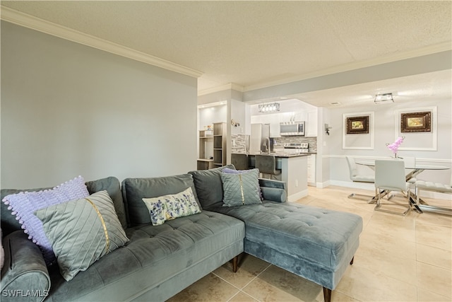 tiled living room featuring a textured ceiling, ornamental molding, and sink