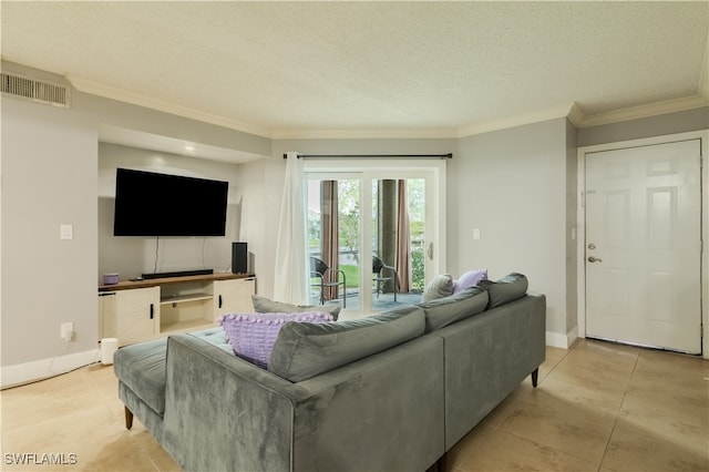 living room with light tile patterned floors, a textured ceiling, and ornamental molding