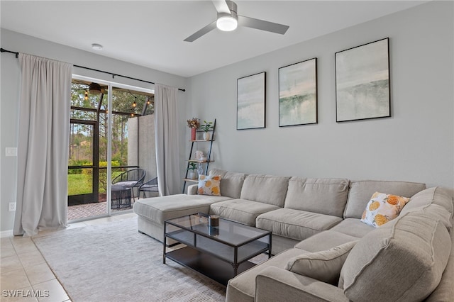 tiled living room with ceiling fan