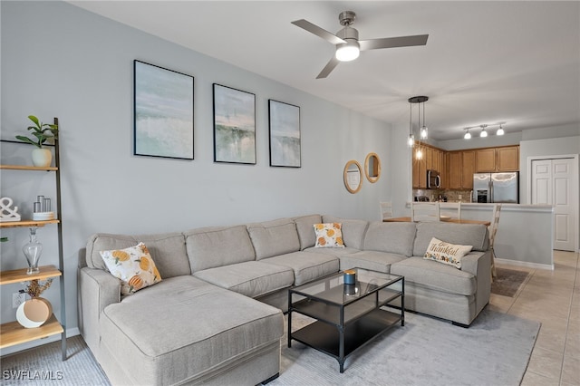 living room with light tile patterned floors and ceiling fan