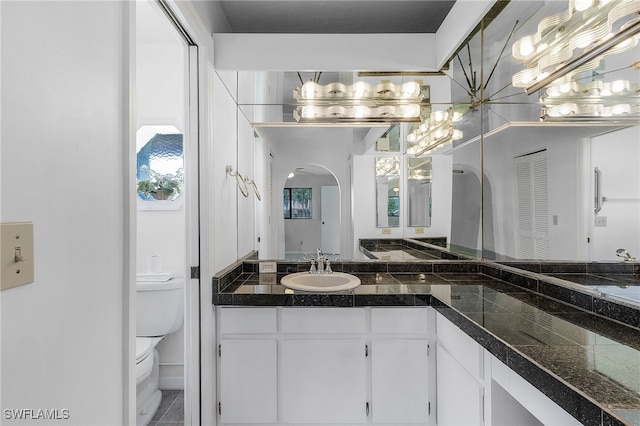 bathroom with vanity and toilet