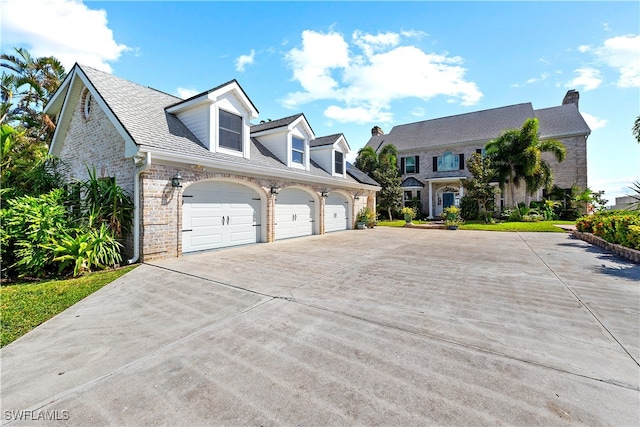 new england style home with a garage