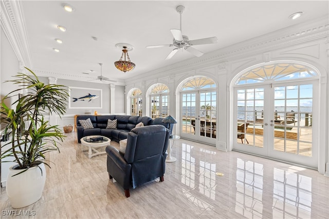 living room with french doors, plenty of natural light, ceiling fan, and crown molding